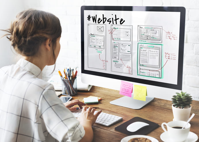 Designer drawing wireframe for Website and Apps